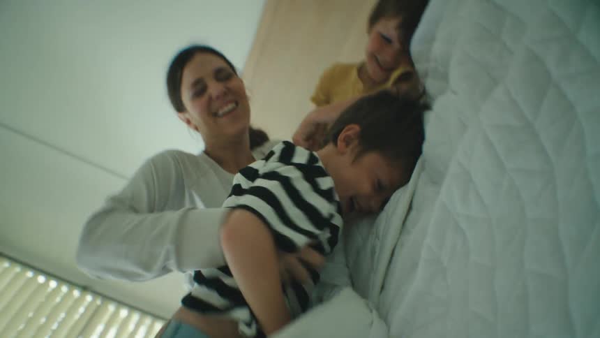 A mother wrestling with her sons