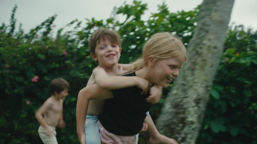 A clip of children playing in the lawn