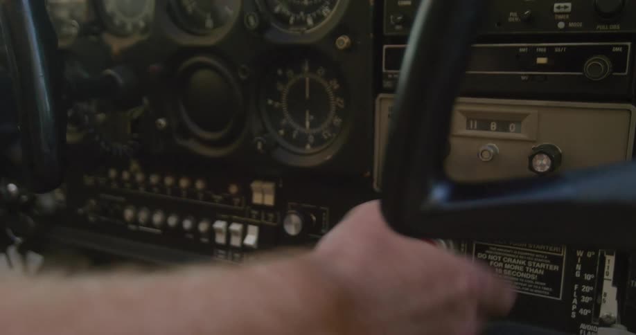 White man piloting an airplane during day time