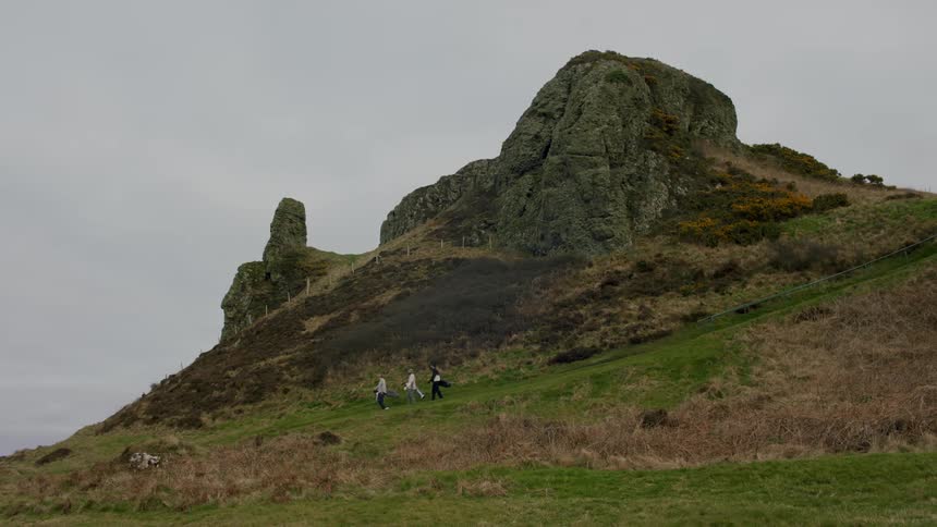 A clip of hikers walking down the hill