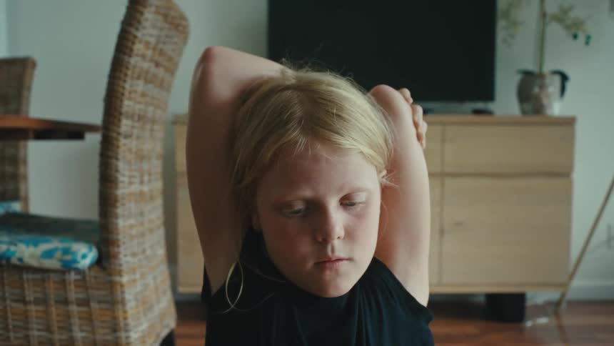 Close up of a girl stretching in the living room