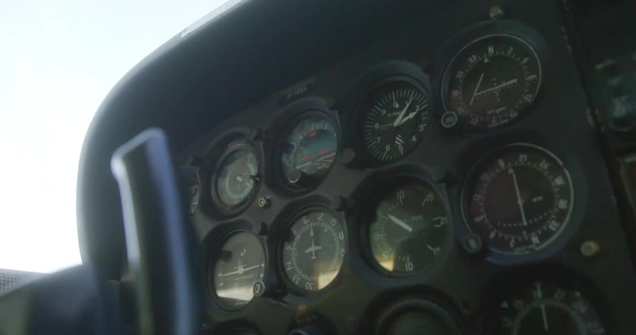 Close up of the gauges on the dashboard of an airplane