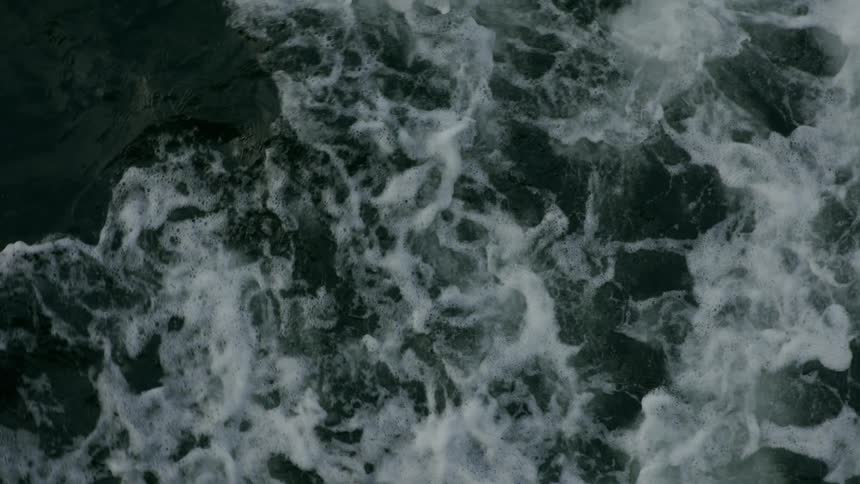 An aerial view of waves out in the middle of the ocean