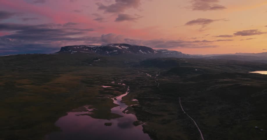 A stream runs up to the mountain range
