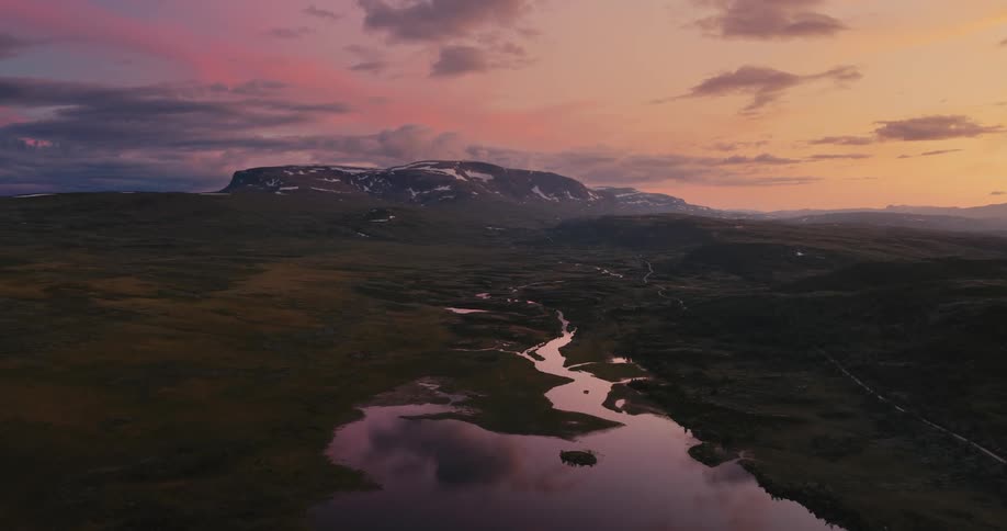 Aerial view of landscape at sunset streams and mountain in distance