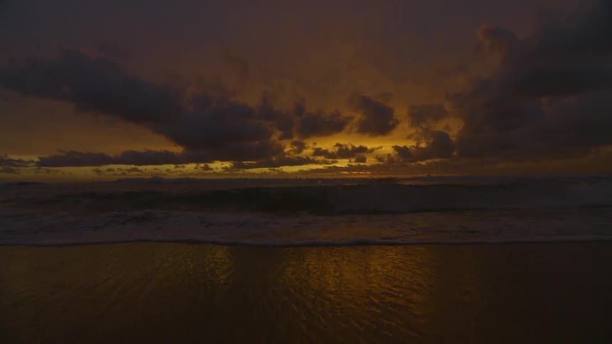 Serene scene of a golden sunset over the ocean