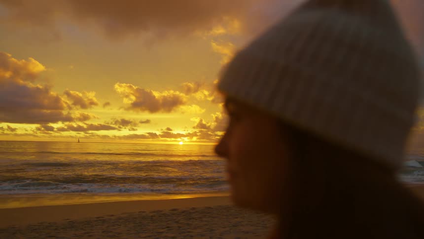 A clip of a lady at the beach front