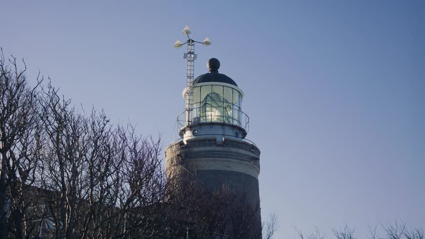 A lighthouse with a large diamond rotating in a dome