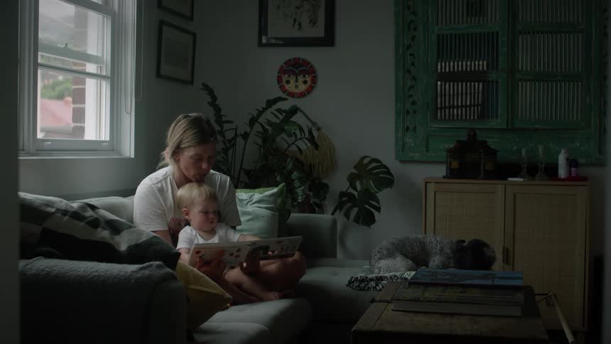 A mother reading a story to her son