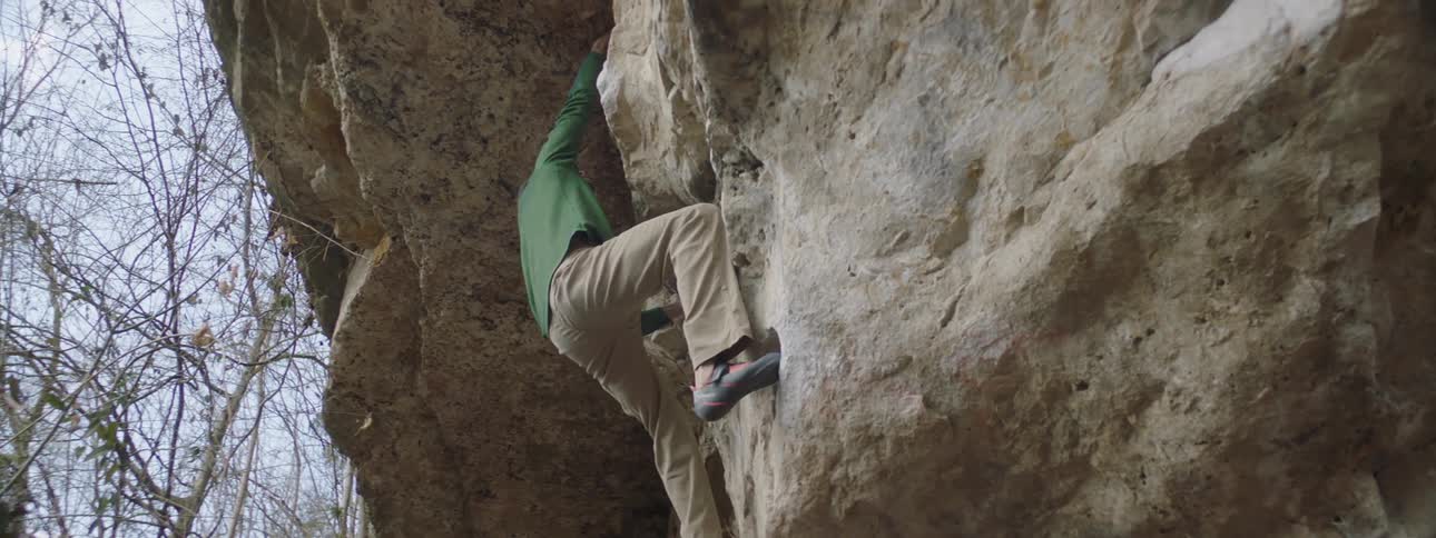 A clip of a man climbing a rock