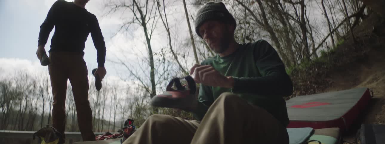 A clip of a man putting on a shoe