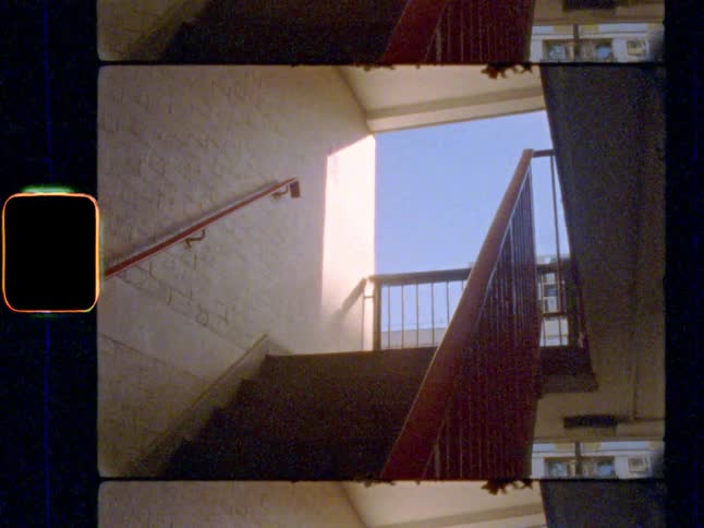 Empty stairwell with shadows and blue sky