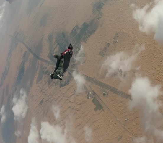 A man skydiving outdoors on a sunny day