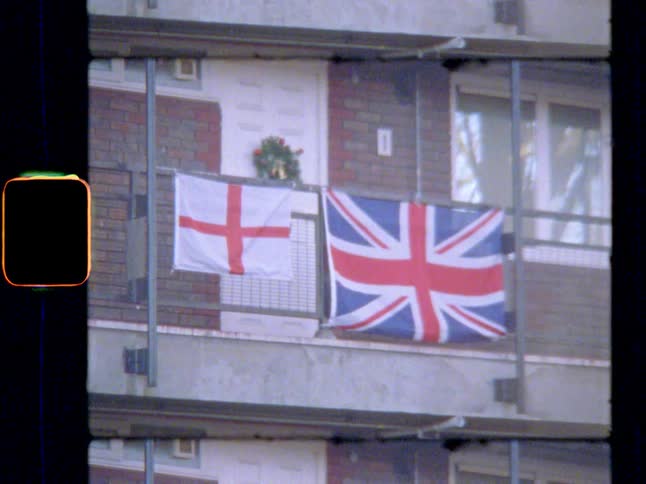 English and British flags hanging outside a doorway