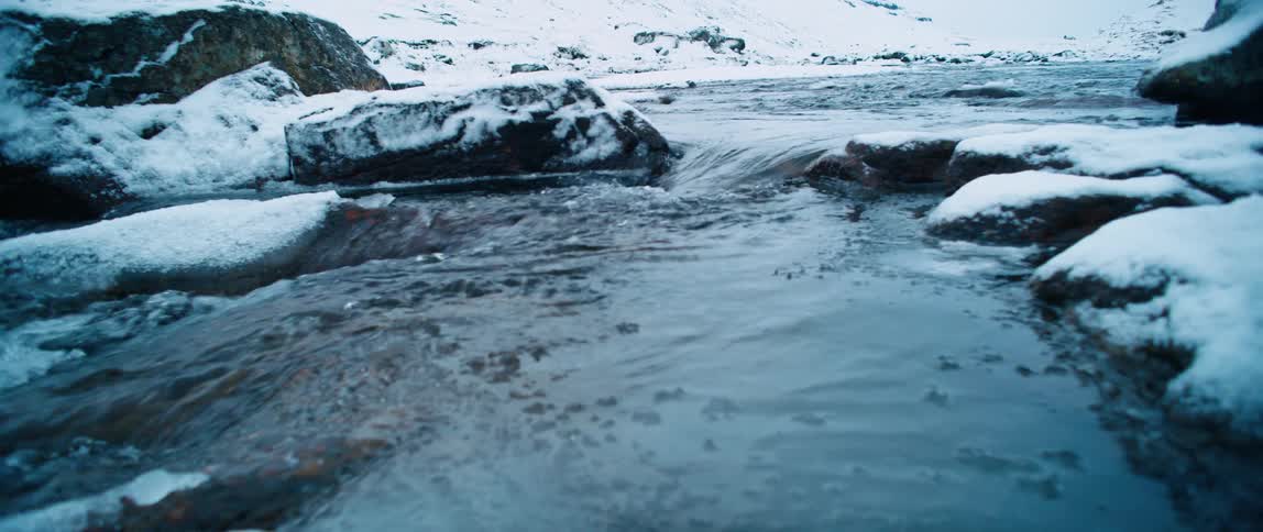 Close up of a river on a frozen landscape