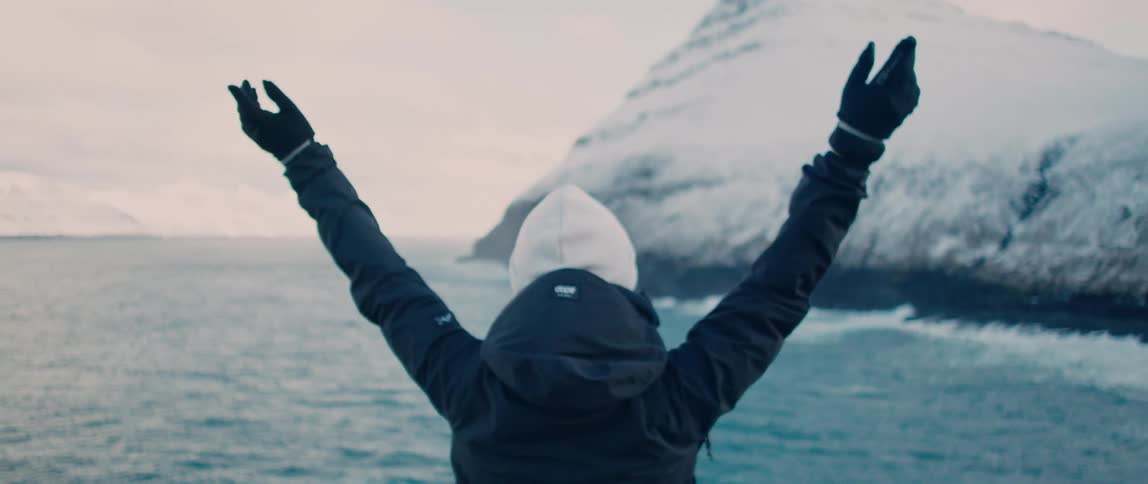 Woman raises her hands by happyness