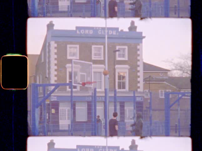 Friends playing basketball outdoors