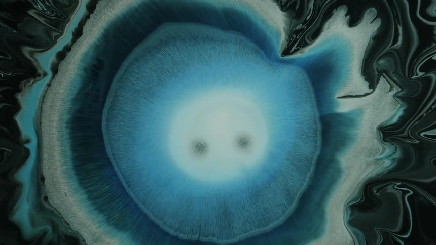 Expanding blob of blue liquid ink art