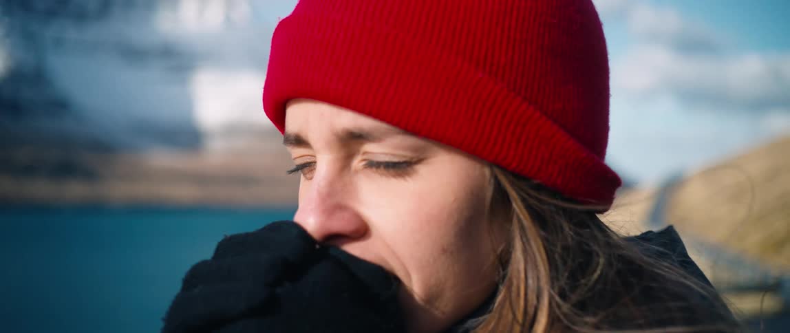 Close shot of a woman looking at the landscape