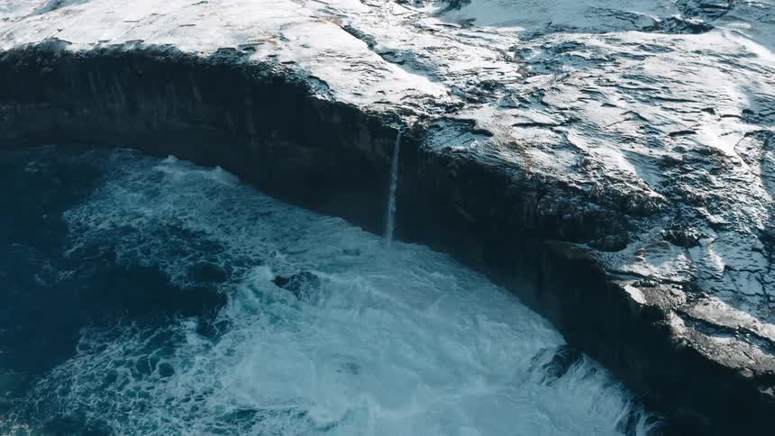 A clip of a water fall in the ice mountain
