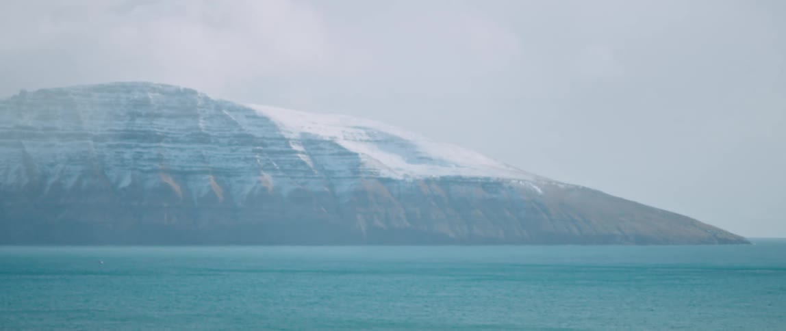 The mountains are covered in fog in Faroe Islands