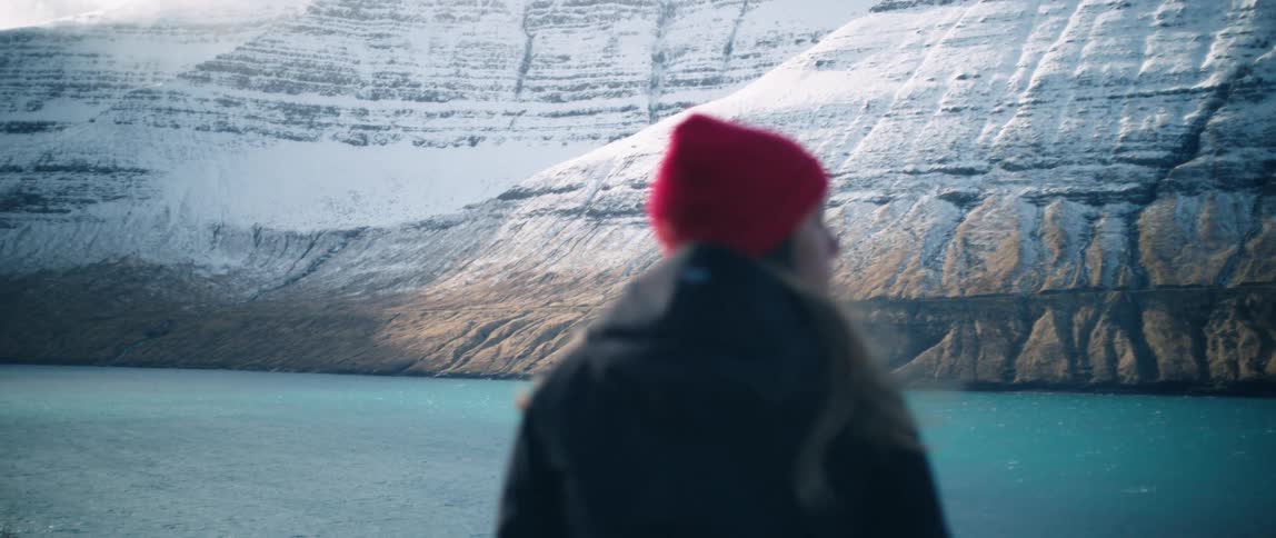 A woman looks at the mountain range