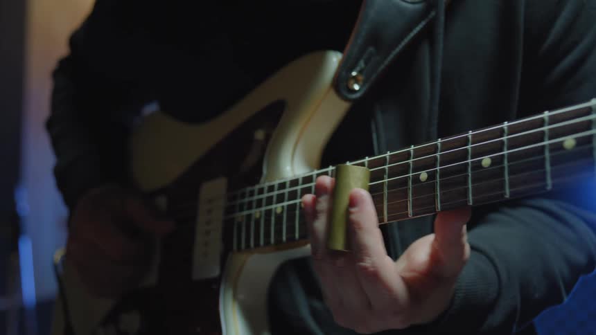 A person playing the guitar
