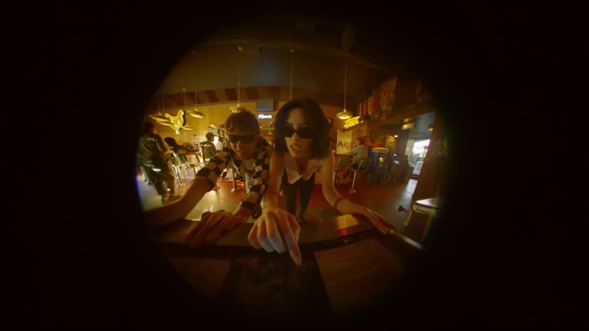 A man and a woman are gambling in a casino