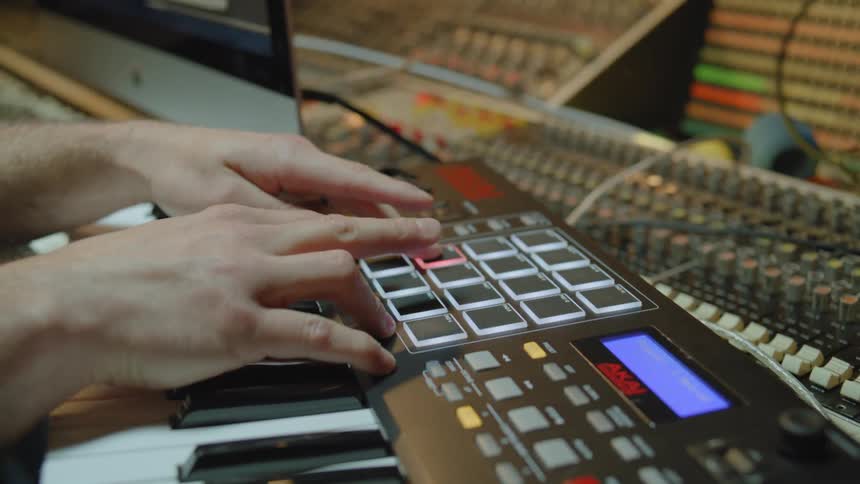 A person is playing the keyboard