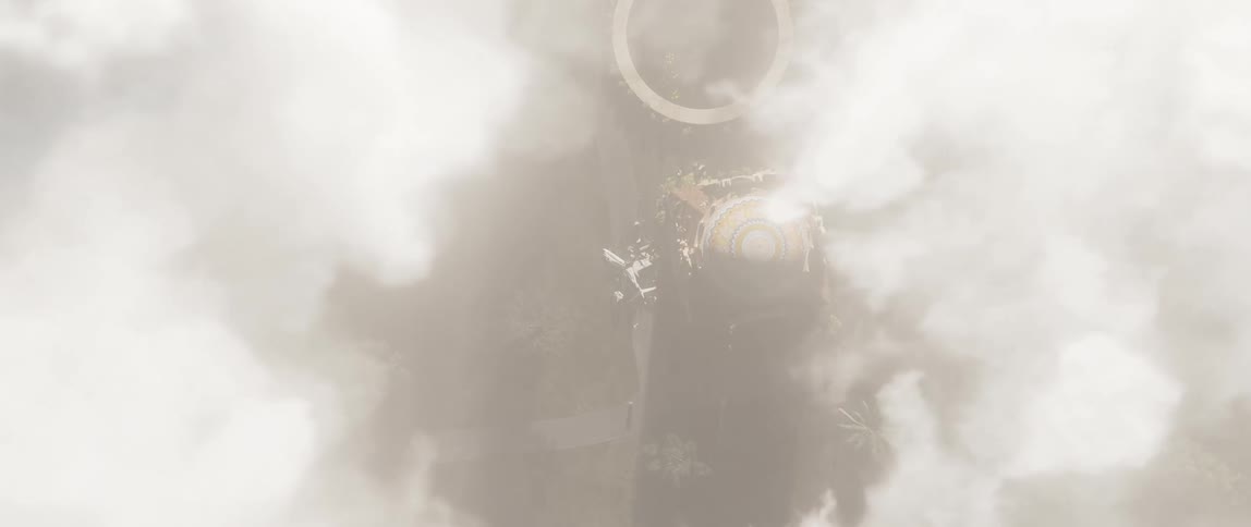 An aerial view of the clouds descending from a building with a dome on top