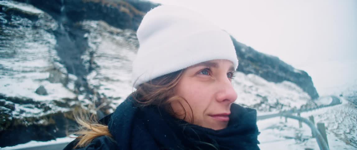 Portrait of a woman is smiling by the mountains
