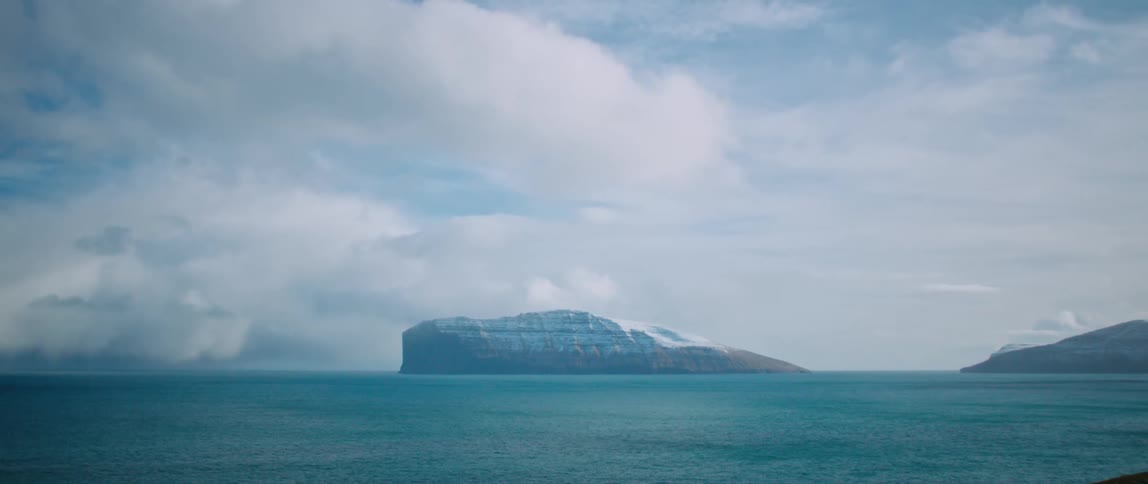 Panorama of the sea with a snowcovered mountain range
