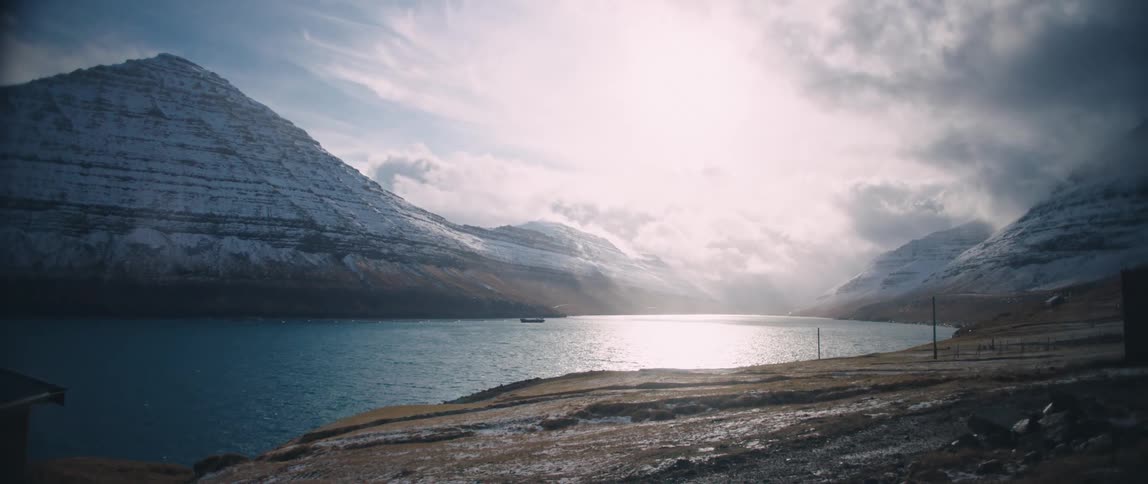 A clip of a seashore and an ice mountain