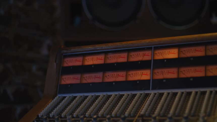 Several hands on a panel moving side to side