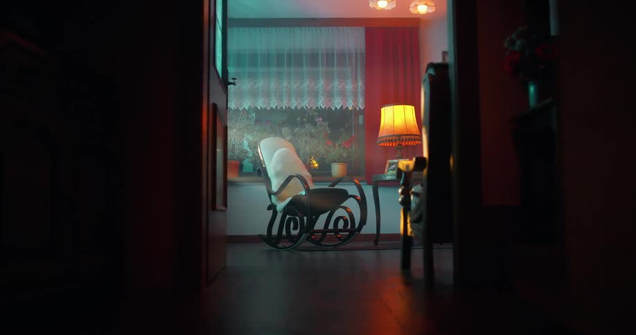 A rocking chair sits in the corner of the room