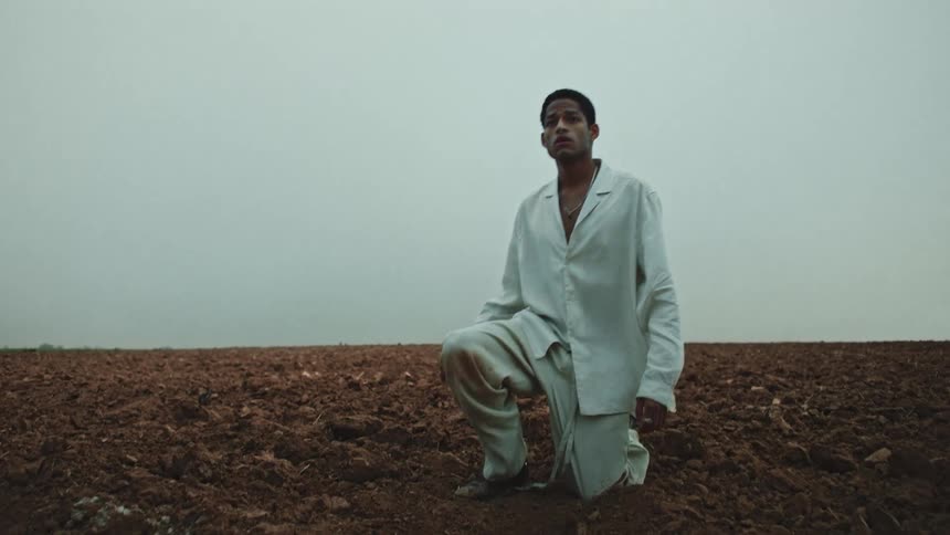 Black male standing up surrounded by fog