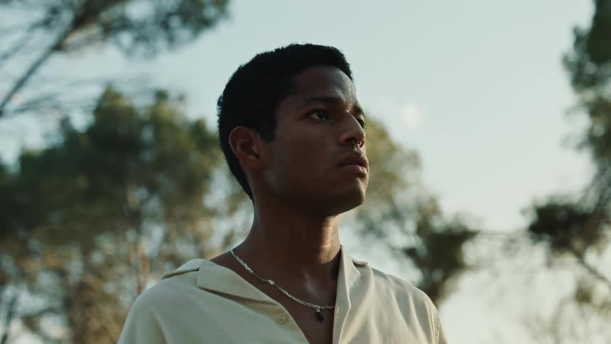 A close up portrait of a young black male