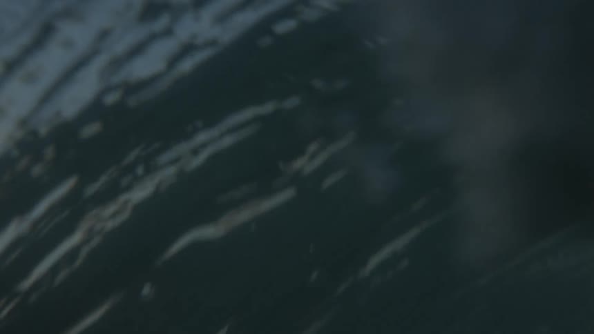 A wave crashes in the ocean