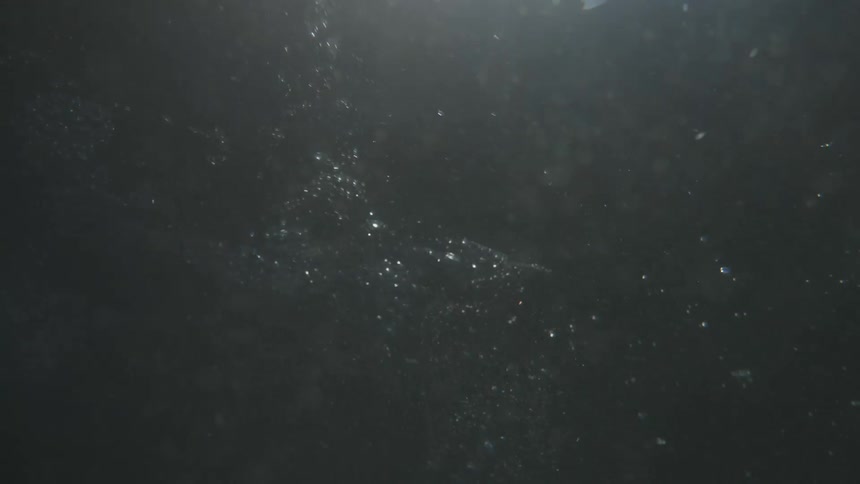 View from inside the blue sea with sunlight reflection