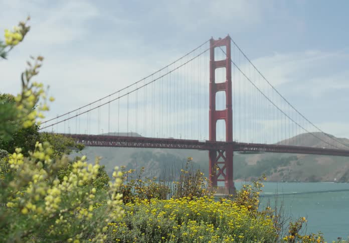 Golden gate bridge over the bay on a partly cloudy day