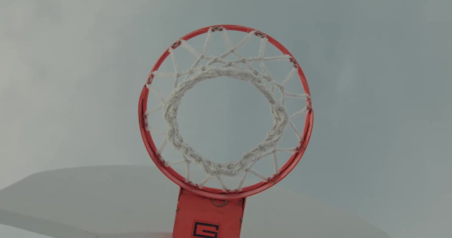 A basketball hoop is shown from above being orbited around slowly