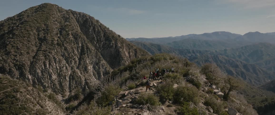 A clip of hikers on a mountain top