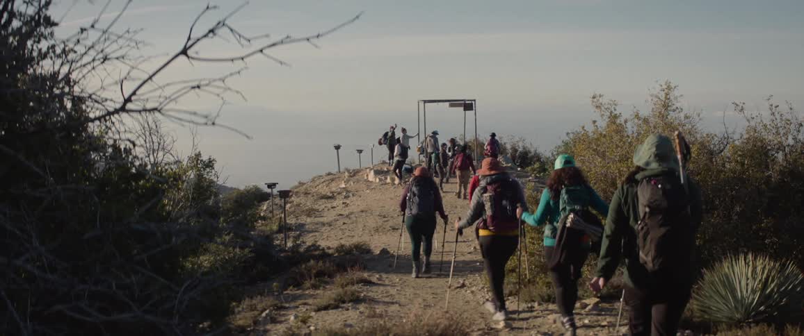 A clip of hikers hiking a mountain range