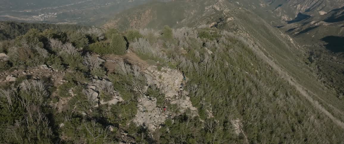 Aerial panorama of a mountain range covered with forests