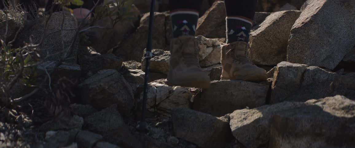People are hiking over the rocks