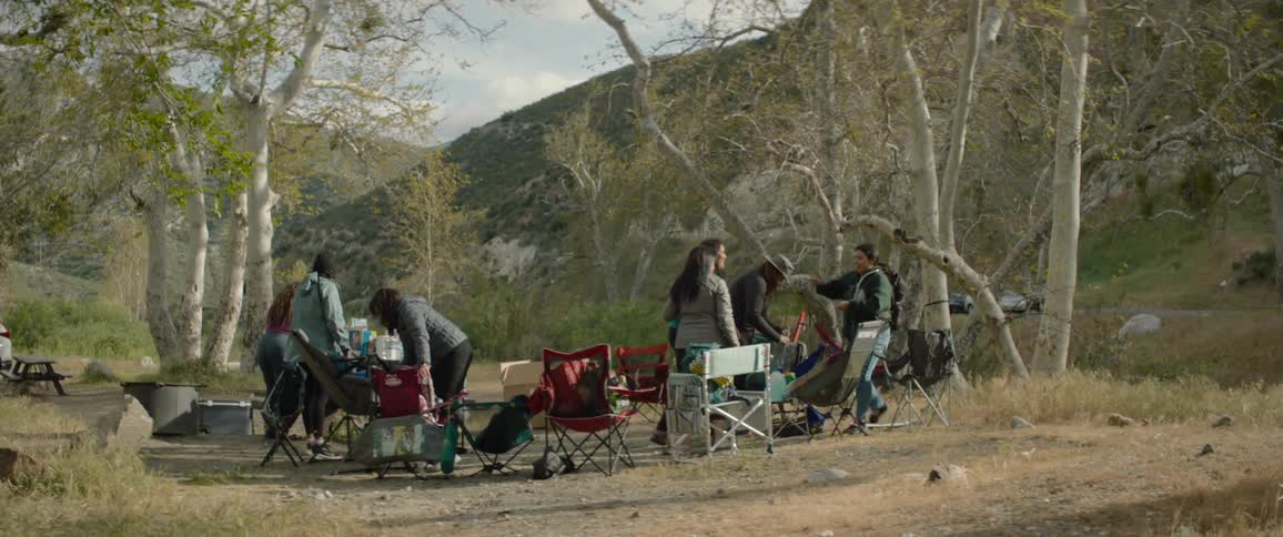 Women hug at the camping site