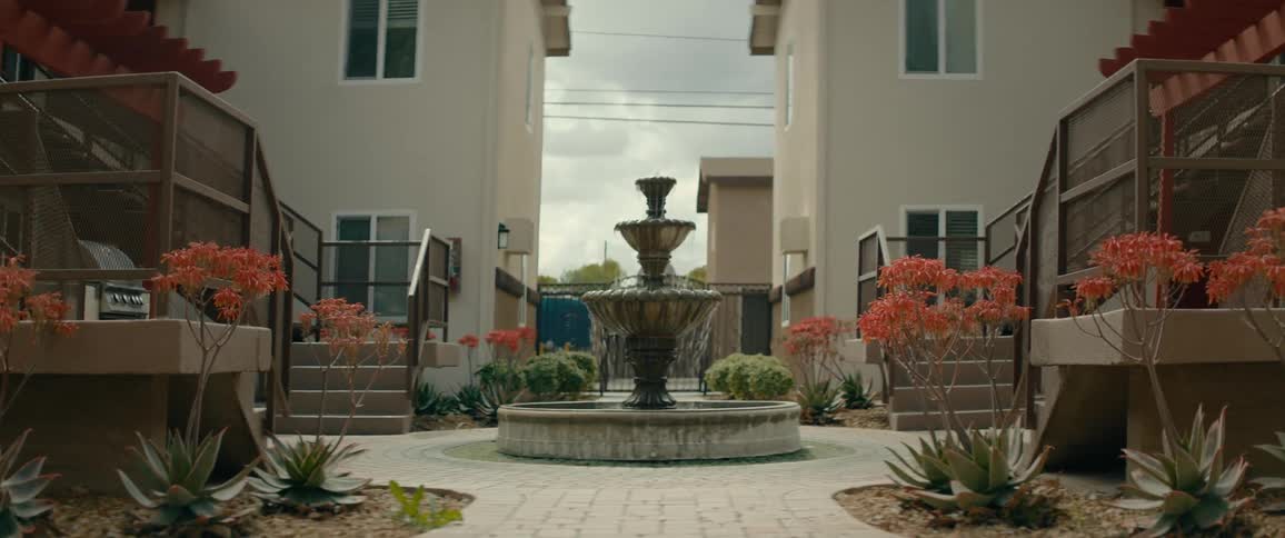 View of a fountain in the midst of a residential condominium