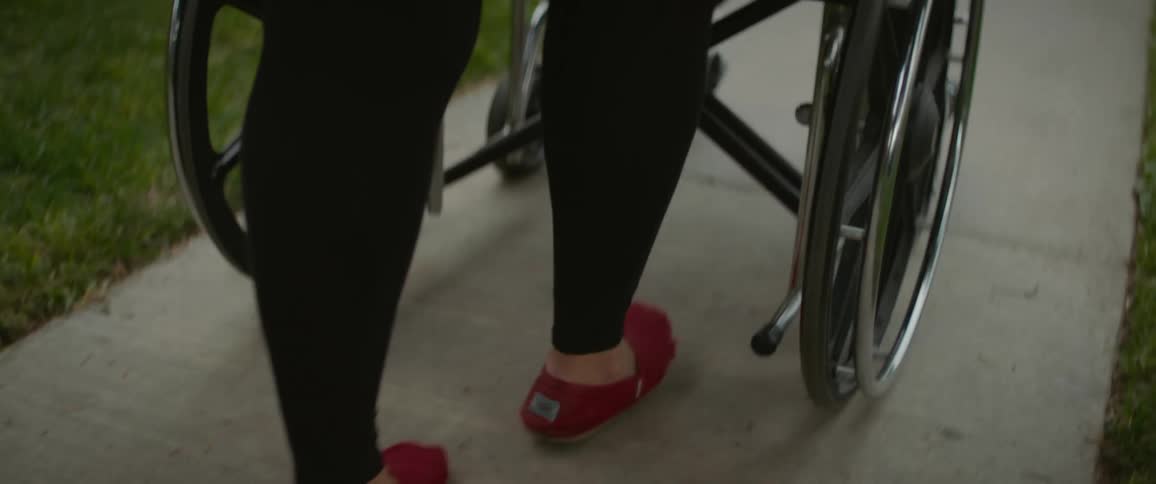 A clip of a person pushing a wheel chair