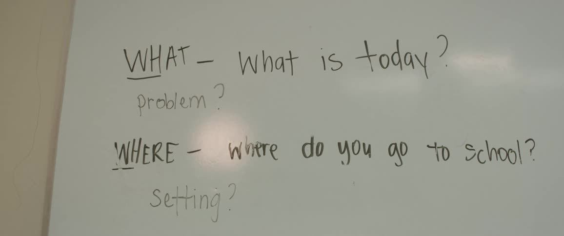 Two sentences cover white board in classroom