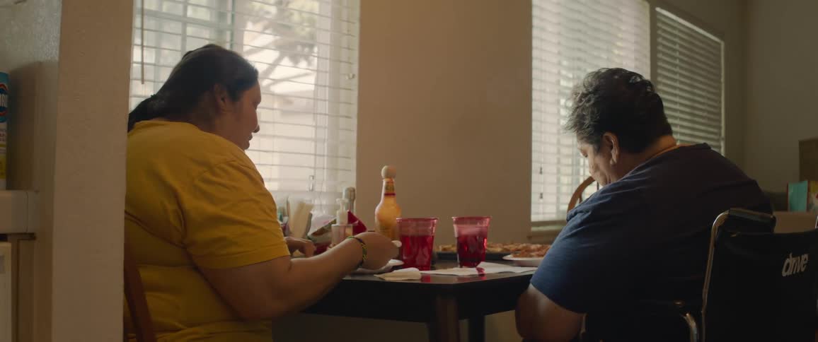 Two women sitting at a table having lunch
